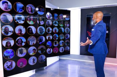 man talking to screens