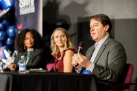 man speaking on panel