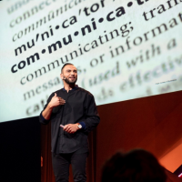 man in front of words