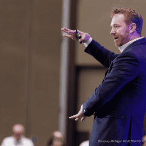 man on stage speaking